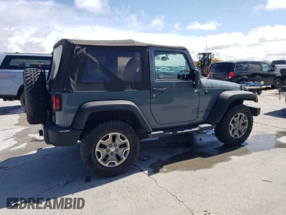 2014 Jeep Wrangler Rubicon z VIN 1C4BJWCG1EL255621, wystawiony jako Copart lot #50314815 z przebiegiem 99 351 mil mil oraz Szkoda całkowita • Salvage title. Historia ofert i sprzedaży dostępna na DreamBid. Obrazek 3.