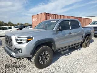 2021 Toyota Tacoma SR with VIN 5TFCZ5AN7MX255218, listed as a Copart auction lot 87247455 with 76,862 mi miles and Salvage title. Bid and sale history available at DreamBid. Image 1.