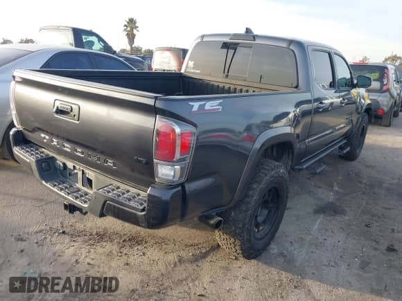 2021 Toyota Tacoma SR5 z VIN 3TMDZ5BN2MM108586, wystawiony jako IAAI lot #41604953 z przebiegiem 65 422 mil mil oraz . Historia ofert i sprzedaży dostępna na DreamBid. Obrazek 4.