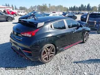 2021 Hyundai Veloster z VIN KMHT36AH2MU008798, wystawiony jako IAAI lot #43306172 z przebiegiem 63 538 mil mil oraz . Historia ofert i sprzedaży dostępna na DreamBid. Obrazek 4.