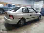 2002 Hyundai Accent z VIN KMHCF35G82U192732, wystawiony jako Copart lot #85187074 z przebiegiem 224 194 mil mil oraz Czysty tytuł • Clean title. Historia ofert i sprzedaży dostępna na DreamBid. Obrazek 3.