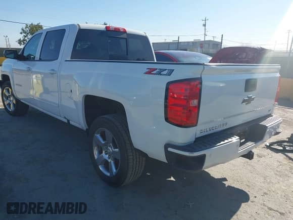 2018 Chevrolet Silverado 1500 LT with VIN 1GCUKRECXJF180945, listed as a IAAI auction lot 42450588 with 108,199 mi miles and . Bid and sale history available at DreamBid. Image 3.