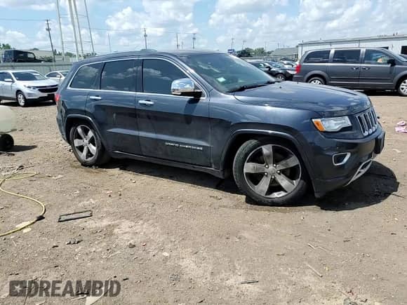2015 Jeep Grand Cherokee Overland with VIN 1C4RJFCT1FC638648, listed as a Copart auction lot 61739035 with 110,519 mi miles and Salvage title. Bid and sale history available at DreamBid. Image 14.