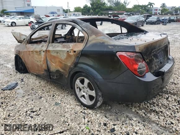 2013 Chevrolet Sonic LTZ с VIN 1G1JE5SHXD4169990, выставлен на аукционе Copart как лот 80101435 с пробегом Не указан миль и На запчасти • Non repairable. История ставок и продаж доступна на DreamBid. Изображение 2.