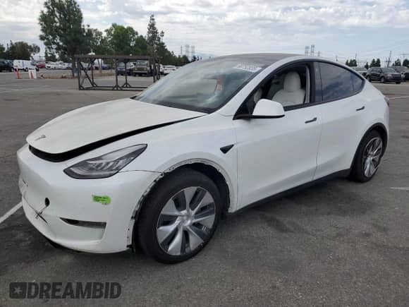 2023 Tesla Model Y Long Range with VIN 7SAYGAEE2PF590760, listed as a Copart auction lot 69752835 with 57,026 mi miles and Salvage title. Bid and sale history available at DreamBid. Image 1.