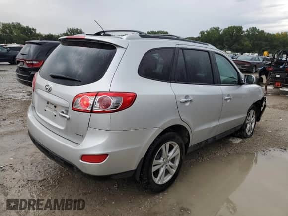 2012 Hyundai Santa Fe Limited с VIN 5XYZK4AG5CG156148, выставлен на аукционе Copart как лот 71792795 с пробегом 184 950 миль миль и Списание • Salvage title. История ставок и продаж доступна на DreamBid. Изображение 3.