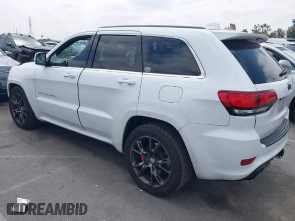 2014 Jeep Grand Cherokee SRT-8 z VIN 1C4RJFDJ7EC536055, wystawiony jako IAAI lot #42194498 z przebiegiem 80 241 mil mil oraz . Historia ofert i sprzedaży dostępna na DreamBid. Obrazek 3.