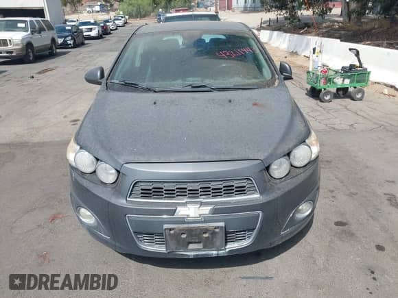 2013 Chevrolet Sonic with VIN 1G1JE6SG0D4170367, listed as a IAAI auction lot 43211443 with 116,449 mi miles and . Bid and sale history available at DreamBid. Image 6.
