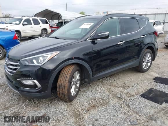 2018 Hyundai Santa Fe 2.0T with VIN 5NMZUDLA3JH057978, listed as a IAAI auction lot 41930580 with 118,100 mi miles and . Bid and sale history available at DreamBid. Image 2.