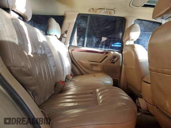 2000 Jeep Grand Cherokee Limited z VIN 1J4GW58N0YC419352, wystawiony jako Copart lot #86405605 z przebiegiem 211 579 mil mil oraz Czysty tytuł • Clean title. Historia ofert i sprzedaży dostępna na DreamBid. Obrazek 10.