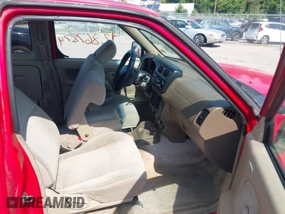 1999 Nissan Frontier XE with VIN 1N6DD26S9XC322264, listed as a IAAI auction lot 42867874 with 230,481 mi miles and . Bid and sale history available at DreamBid. Image 5.