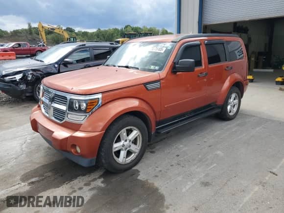 2007 Dodge Nitro SLT with VIN 1D8GU58K57W609390, listed as a Copart auction lot 71275105 with 166,051 mi miles and Salvage title. Bid and sale history available at DreamBid. Image 1.