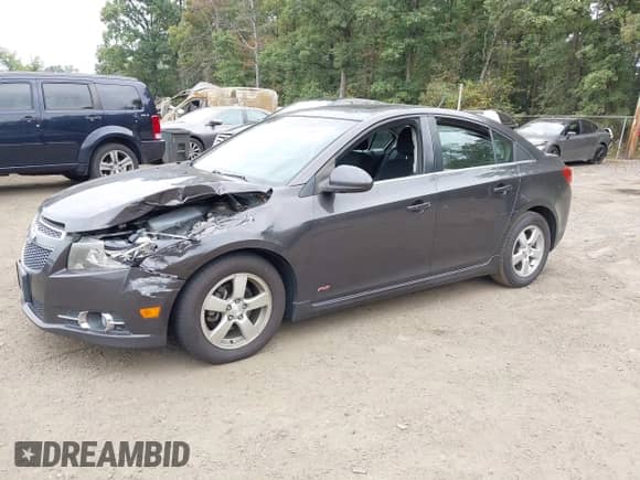2014 Chevrolet Cruze 1LT with VIN 1G1PC5SB1E7306214, listed as a IAAI auction lot 43287022 with 140,046 mi miles and . Bid and sale history available at DreamBid. Image 2.