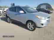 2011 Hyundai Tucson Limited with VIN KM8JU3AC7BU213263, listed as a Copart auction lot 52646455 with 165,236 mi miles and Salvage title. Bid and sale history available at DreamBid. Image 4.