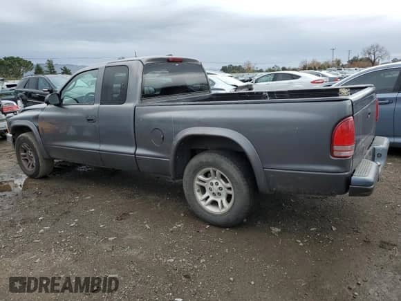 2002 Dodge Dakota с VIN 1B7GL12XX2S718443, выставлен на аукционе Copart как лот 84568934 с пробегом 122 127 миль миль и Чистый • Clean title. История ставок и продаж доступна на DreamBid. Изображение 2.