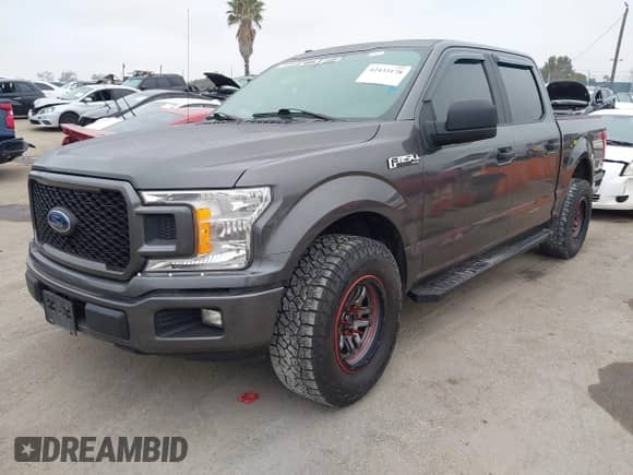 2018 Ford F-150 XL with VIN 1FTEW1CPXJKF05181, listed as a IAAI auction lot 42433178 with 97,101 mi miles and . Bid and sale history available at DreamBid. Image 2.