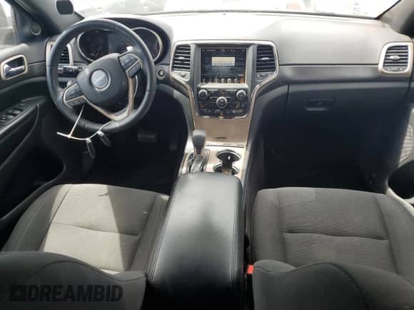 2017 Jeep Grand Cherokee Laredo with VIN 1C4RJEAG4HC656614, listed as a Copart auction lot 67652725 with 144,430 mi miles and Salvage title. Bid and sale history available at DreamBid. Image 8.