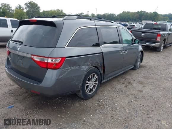 2012 Honda Odyssey EX z VIN 5FNRL5H40CB083650, wystawiony jako IAAI lot #43283741 z przebiegiem 164 693 mil mil oraz . Historia ofert i sprzedaży dostępna na DreamBid. Obrazek 4.