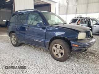 2003 Chevrolet Tracker LT with VIN 2CNBJ634536931981, listed as a Copart auction lot 71785304 with 150,918 mi miles and Salvage title. Bid and sale history available at DreamBid. Image 4.