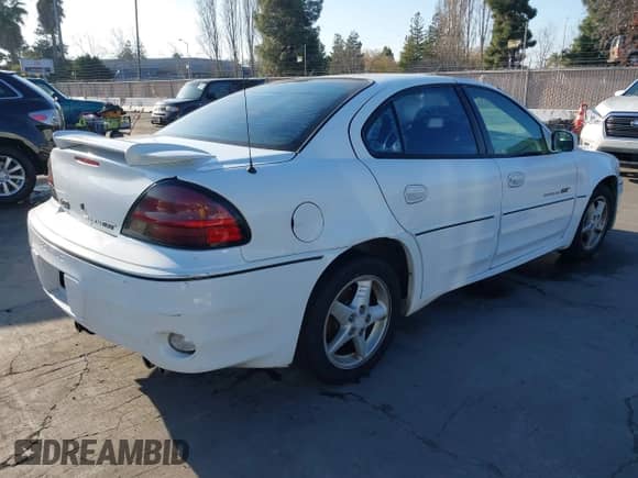 2000 Pontiac Grand Am GT z VIN 1G2NW52E9YM800122, wystawiony jako IAAI lot #41337074 z przebiegiem 235 640 mil mil oraz . Historia ofert i sprzedaży dostępna na DreamBid. Obrazek 4.