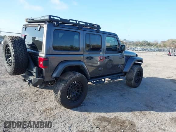 2021 Jeep Wrangler Unlimited Sahara High Altitude with VIN 1C4HJXEM8MW670290, listed as a IAAI auction lot 41547689 with 21,862 mi miles and . Bid and sale history available at DreamBid. Image 4.