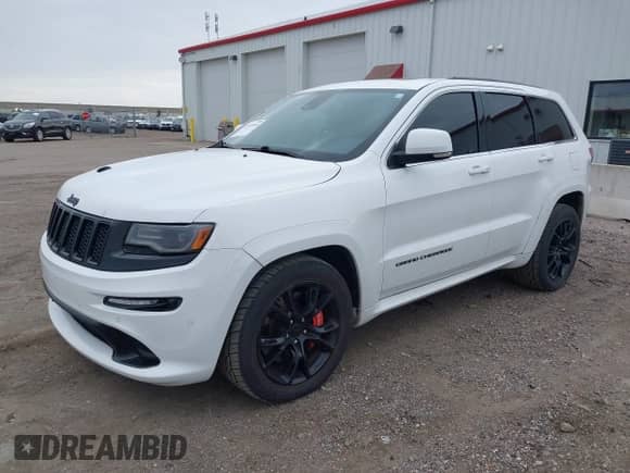 2015 Jeep Grand Cherokee SRT with VIN 1C4RJFDJ4FC882940, listed as a IAAI auction lot 43549108 with 18,901 mi miles and . Bid and sale history available at DreamBid. Image 2.