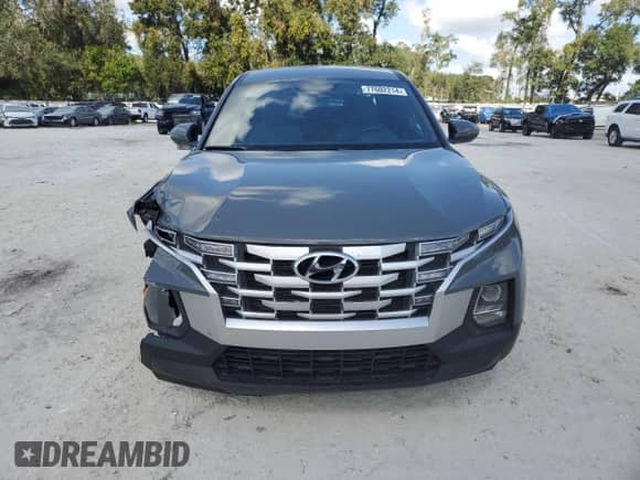 2023 Hyundai Santa Cruz SEL с VIN 5NTJB4AE1PH057774, выставлен на аукционе Copart как лот 77602214 с пробегом 25 938 миль миль и На запчасти • Non repairable. История ставок и продаж доступна на DreamBid. Изображение 5.