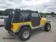 2000 Jeep Wrangler SE with VIN 1J4FA29P0YP775110, listed as a Copart auction lot 71498795 with 72,782 mi miles and Clean title. Bid and sale history available at DreamBid. Image 3.