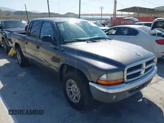 2004 Dodge Dakota SLT with VIN 1D7HL48K24S618072, listed as a IAAI auction lot 42001943 with 202,449 mi miles and . Bid and sale history available at DreamBid. Image 1.