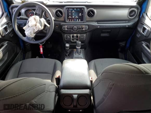 2023 Jeep Wrangler Sport S with VIN 1C4HJXDG7PW677814, listed as a Copart auction lot 67802085 with 28,546 mi miles and Salvage title. Bid and sale history available at DreamBid. Image 8.