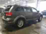 2017 Dodge Journey SXT with VIN 3C4PDDBG1HT561018, listed as a Copart auction lot 69006095 with 136,612 mi miles and Salvage title. Bid and sale history available at DreamBid. Image 3.