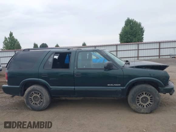 2002 Chevrolet Blazer LS z VIN 1GNDT13W22K228255, wystawiony jako IAAI lot #42923627 z przebiegiem 166 545 mil mil oraz . Historia ofert i sprzedaży dostępna na DreamBid. Obrazek 12.