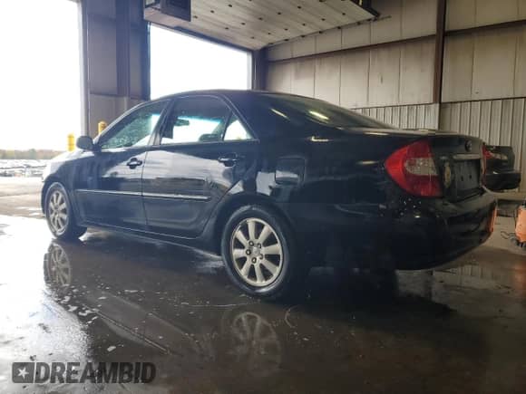 2004 Toyota Camry XLE z VIN 4T1BF30K94U074358, wystawiony jako Copart lot #86265155 z przebiegiem 185 924 mil mil oraz Szkoda całkowita • Salvage title. Historia ofert i sprzedaży dostępna na DreamBid. Obrazek 2.