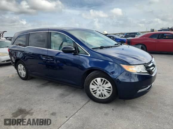 2015 Honda Odyssey LX with VIN 5FNRL5H24FB090989, listed as a Copart auction lot 85265575 with 129,952 mi miles and Salvage title. Bid and sale history available at DreamBid. Image 4.