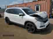 2017 Honda Pilot EX-L with VIN 5FNYF5H82HB004086, listed as a Copart auction lot 68519725 with 135,291 mi miles and Salvage title. Bid and sale history available at DreamBid. Image 4.