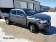2021 Toyota Tacoma TRD Off Road with VIN 3TMCZ5AN9MM392750, listed as a Copart auction lot 70289245 with 76,487 mi miles and Salvage title. Bid and sale history available at DreamBid. Image 4.