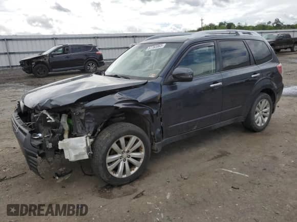2011 Subaru Forester z VIN JF2SHBHC7BH719649, wystawiony jako Copart lot #57782065 z przebiegiem 241 157 mil mil oraz Szkoda całkowita • Salvage title. Historia ofert i sprzedaży dostępna na DreamBid. Obrazek 1.