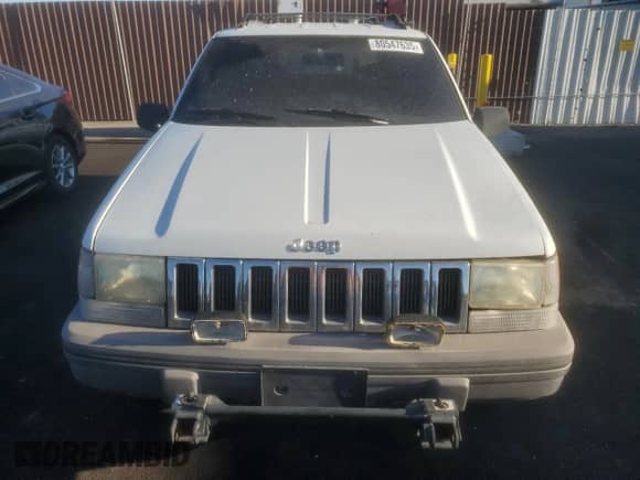 1995 Jeep Grand Cherokee Laredo with VIN 1J4GZ58Y6SC712472, listed as a Copart auction lot 80547635 with 214,089 mi miles and Salvage title. Bid and sale history available at DreamBid. Image 5.