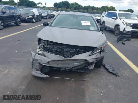 2021 Toyota Camry LE z VIN 4T1C11AK7MU480046, wystawiony jako IAAI lot #43289437 z przebiegiem 70 687 mil mil oraz . Historia ofert i sprzedaży dostępna na DreamBid. Obrazek 13.