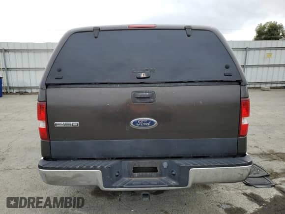 2005 Ford F-150 XLT with VIN 1FTPX12575NA85342, listed as a Copart auction lot 82204225 with 221,143 mi miles and Salvage title. Bid and sale history available at DreamBid. Image 6.