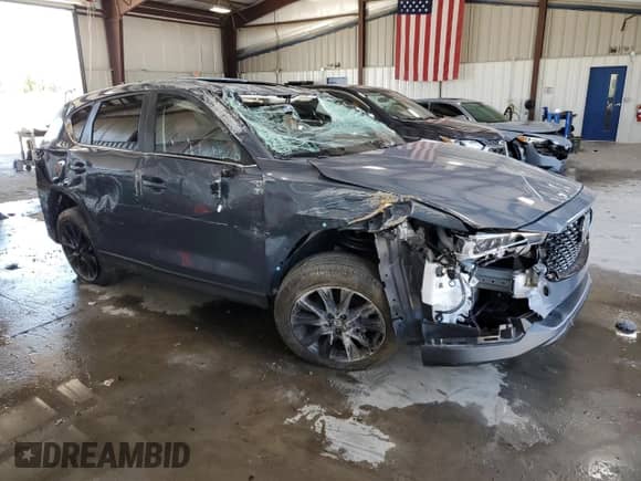 2022 Mazda CX-5 S Carbon Edition z VIN JM3KFBCM3N0639523, wystawiony jako Copart lot #71176405 z przebiegiem 23 821 mil mil oraz Szkoda całkowita • Salvage title. Historia ofert i sprzedaży dostępna na DreamBid. Obrazek 4.
