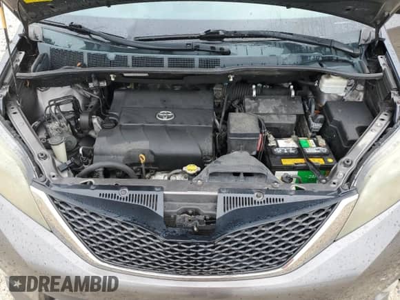 2012 Toyota Sienna SE with VIN 5TDXK3DC7CS249170, listed as a Copart auction lot 81018255 with 152,596 mi miles and Salvage title. Bid and sale history available at DreamBid. Image 12.