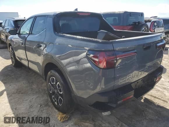 2024 Hyundai Santa Cruz SEL z VIN 5NTJBDAE9RH101121, wystawiony jako Copart lot #77306254 z przebiegiem Nie podano mil oraz Nie do naprawy • Non repairable. Historia ofert i sprzedaży dostępna na DreamBid. Obrazek 2.