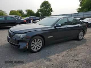 2010 BMW 7 Series 750i xDrive with VIN WBAKC6C51ACL67738, listed as a Copart auction lot 57118295 with 124,911 mi miles and Salvage title. Bid and sale history available at DreamBid. Image 1.