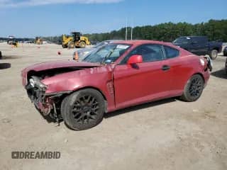 2006 Hyundai Tiburon GS with VIN KMHHM65D46U229462, listed as a Copart auction lot 70912605 with 169,009 mi miles and Salvage title. Bid and sale history available at DreamBid. Image 1.