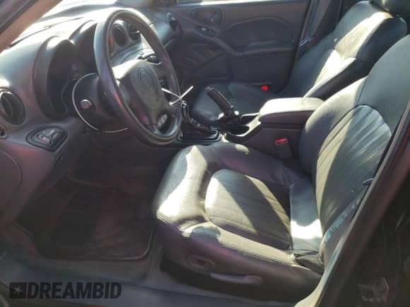 2002 Pontiac Grand Am GT z VIN 1G2NW52E12M704539, wystawiony jako Copart lot #73755214 z przebiegiem 100 904 mil mil oraz Czysty tytuł • Clean title. Historia ofert i sprzedaży dostępna na DreamBid. Obrazek 7.