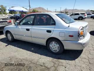 2002 Hyundai Accent GL с VIN KMHCG45C92U353198, выставлен на аукционе Copart как лот 68305654 с пробегом 130 594 миль миль и Чистый • Clean title. История ставок и продаж доступна на DreamBid. Изображение 2.