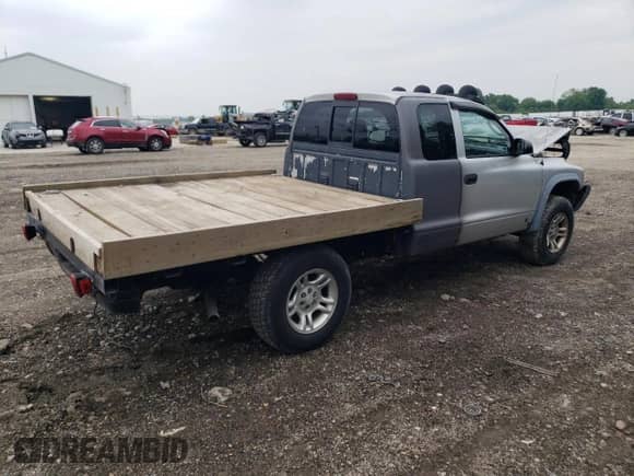 2003 Dodge Dakota с VIN 1D7HG12X13S196592, выставлен на аукционе Copart как лот 58576995 с пробегом 22 818 миль миль и Списание • Salvage title. История ставок и продаж доступна на DreamBid. Изображение 3.