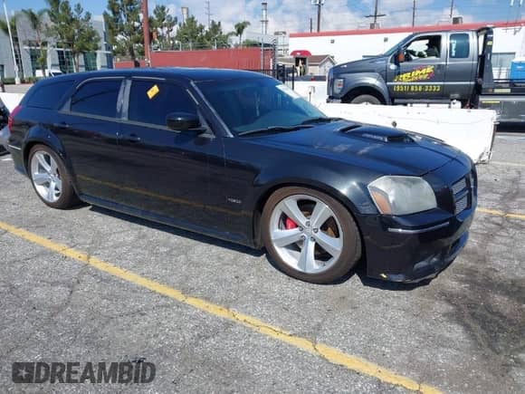 2007 Dodge Magnum SRT-8 z VIN 2D4GV773X7H654618, wystawiony jako IAAI lot #41752289 z przebiegiem 103 819 mil mil oraz . Historia ofert i sprzedaży dostępna na DreamBid. Obrazek 1.