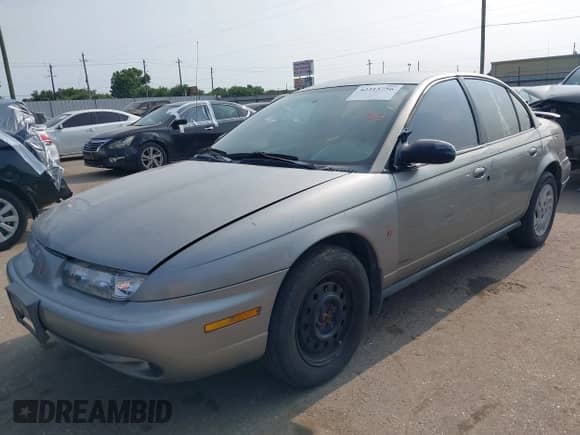 1999 Saturn SL z VIN 1G8ZK5274XZ319152, wystawiony jako IAAI lot #42315756 z przebiegiem Nie podano mil oraz . Historia ofert i sprzedaży dostępna na DreamBid. Obrazek 2.